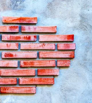 Old brick placed in the wall, interesting and original background Foto stock
