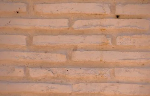 Old brick placed in the wall, interesting and original background Foto stock