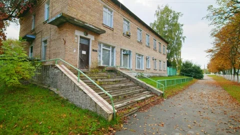 Old Brick School Building in Autumn Stock Footage 316858448