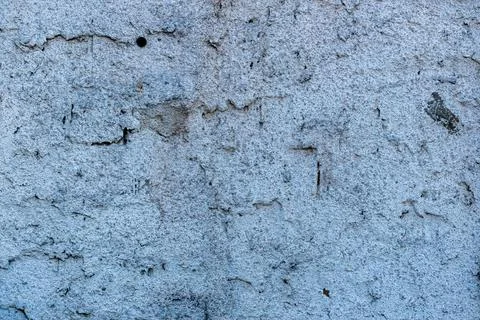 Old brick shining through a rough plastered surface 写真素材