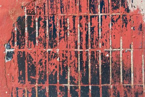 Old brick tile wall texture of the house, cracks, signs of wear and dirt. Stock Photos
