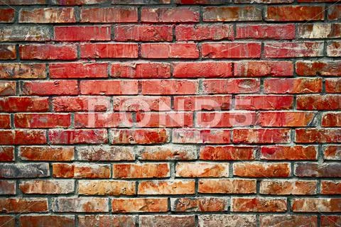 Old brick wall background image. Weathered texture of stained dark brown and Stock Photos