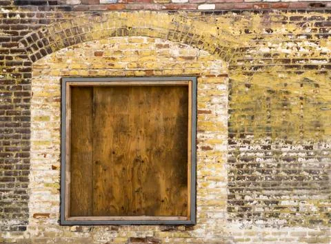 Old brick wall with boarded up window 2 Stock Photos