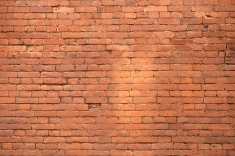 Old brick wall. Brickwork from an old brick in a rustic style. The structure  Stock Photos