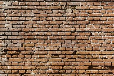 Old brick wall. Brickwork from an old brick in a rustic style. The structure and Stock Photos