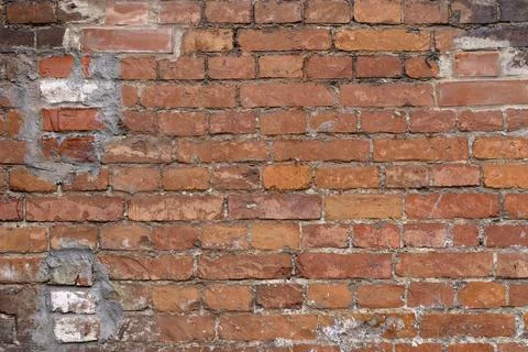 Old brick wall. Brickwork from an old brick in a rustic style. The structure and Stock Photos