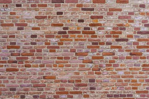 Old brick wall. Brickwork from an old brick in a rustic style. The structure and Stock Photos