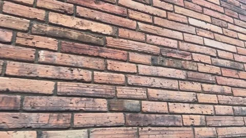 Old brick wall with chipped, cracked bricks and rough weathered surface Stock Footage 313475679