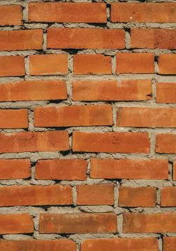 Old brick wall close-up. Background image with brick texture. Stock Photos