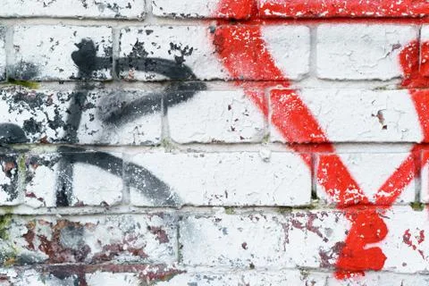 The old brick wall in colored paint. background Stock Photos