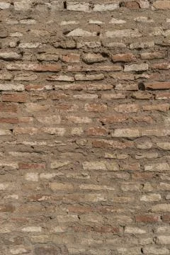 Old brick wall with cracks and scratches. Brick wall background. Distressed w Stock Photos