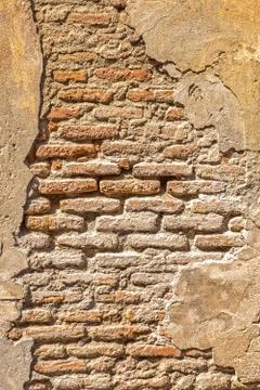 Old brick wall with crumbling plaster Stock Photos