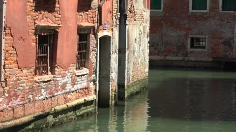 Old brick wall with damaged plaster stands in Venice Italy with weathered - Top Stock Footage 339564180