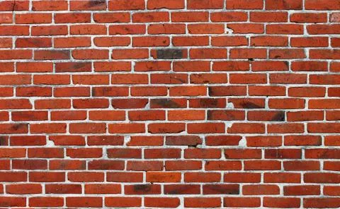 An old brick wall. Dark red background. Stock Photos