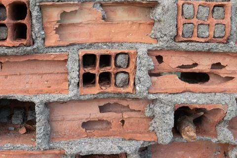 Old brick wall with the destroyed brick. The interior of the brick, holes in  Stock Photos