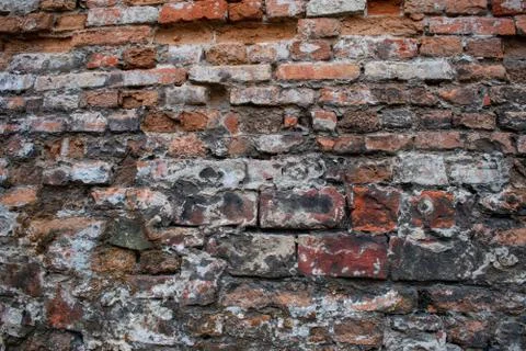 Old brick wall. Destroyed brick. Beautiful ornamental background Stock Photos