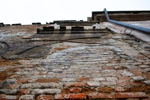 Old brick wall. Destroyed brick. The wall of a medieval castle Stock Photos