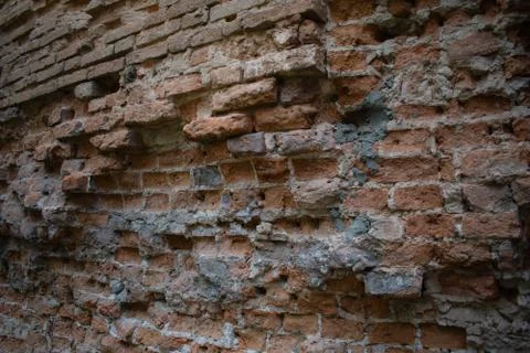Old brick wall. Destroyed brick. Beautiful ornamental background Stock Photos