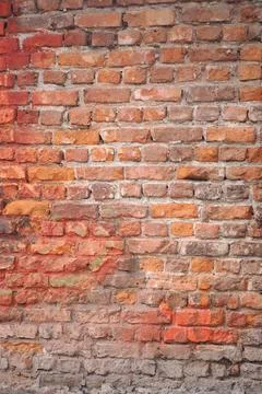 Old brick wall with different shades and textures visible Stockfoto's