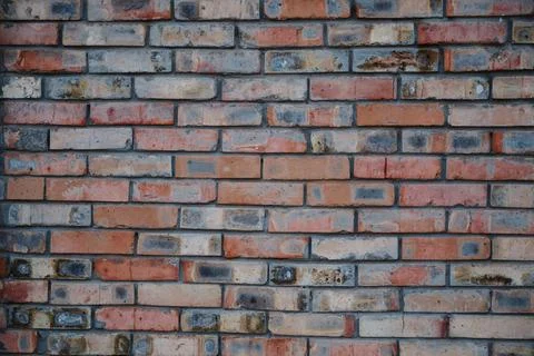 An old brick wall, the facade of the building. Abstract texture background Stock Photos