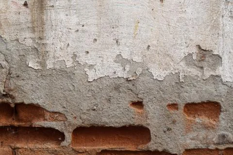 Old brick wall with fallen plaster Foto stock