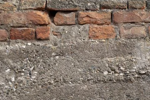 Old brick wall with fallen plaster Foto stock
