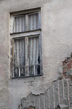 Old brick wall with fallen plaster and a window Stock-Fotos