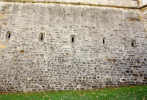 Old brick wall with five loophole Stock Photos