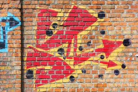 Old brick wall with graffiti Stock Photos
