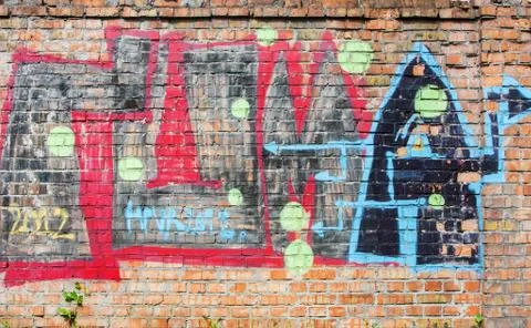 Old brick wall with graffiti Stock Photos