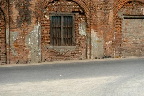 Old brick wall of house with window, Radshahi Bangladesh. Stock Photos