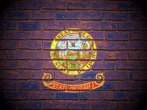 Old brick wall Idaho state flag Stock Illustration