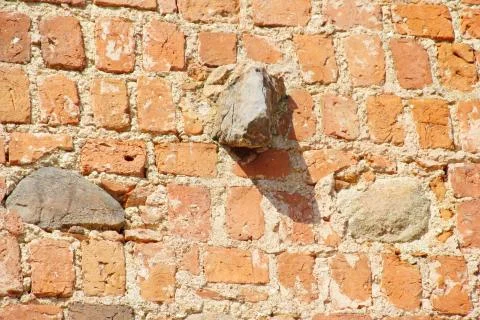 Old brick wall made of red clay brick Stock Photos