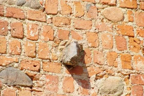 Old brick wall made of red clay brick Stock Photos