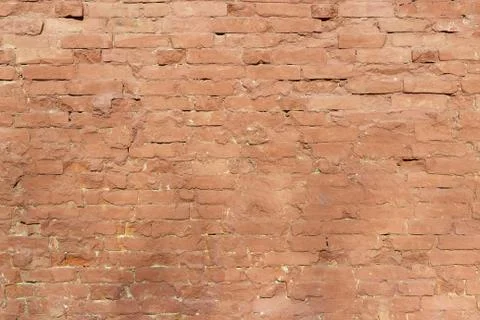 Old brick wall, old texture of red stone blocks closeup Stock Photos