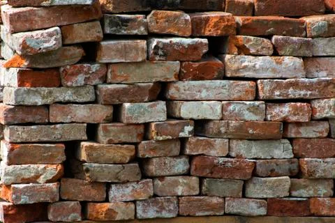 Old brick wall, old texture of red stone blocks closeup Stock Photos
