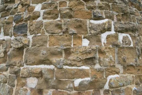 Old brick wall, old texture of red stone blocks closeup Stock Photos
