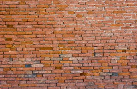 Old brick wall, old texture of red stone blocks closeup Stock Photos