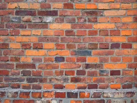 Old brick wall, old texture of red stone blocks closeup Stock Photos