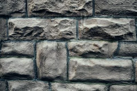 Old brick wall, old texture of red stone blocks closeup high middle age Foto stock