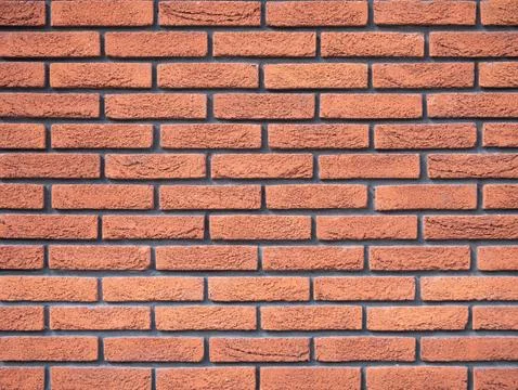 Old brick wall, old texture of red stone blocks closeup Stock Photos