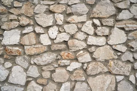 Old brick wall, old texture of stone blocks closeup Stock Photos