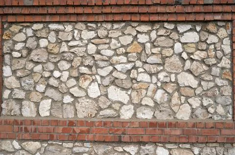 Old brick wall, old texture of stone blocks closeup Stock Photos