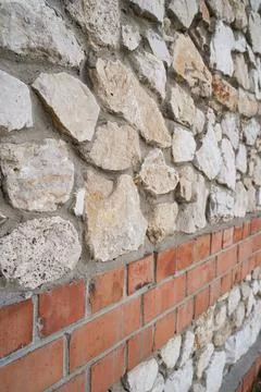 Old brick wall, old texture of stone blocks closeup Stock Photos