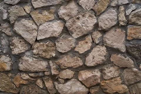 Old brick wall, old texture of stone blocks closeup Stock Photos