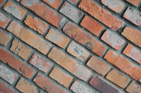 Old brick wall, old texture of red stone blocks closeup Stock Photos