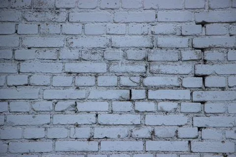 Old brick wall painted into solid blue. Beautiful grunge surface background Stockfoto's