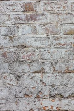 Old brick wall painted with white paint Stock Photos