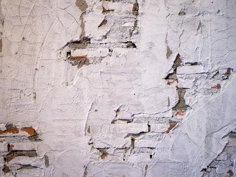 Old brick wall with peeling plaster for background Stock Photos