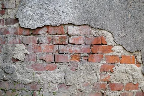 Old brick wall with plaster. Texture, background Stock Photos
